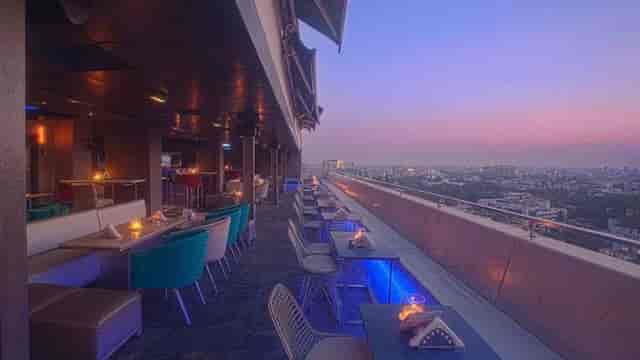 Rooftop bar at Hotel Ivory Tower, Bangalore, ideal for upscale evening events and gatherings.