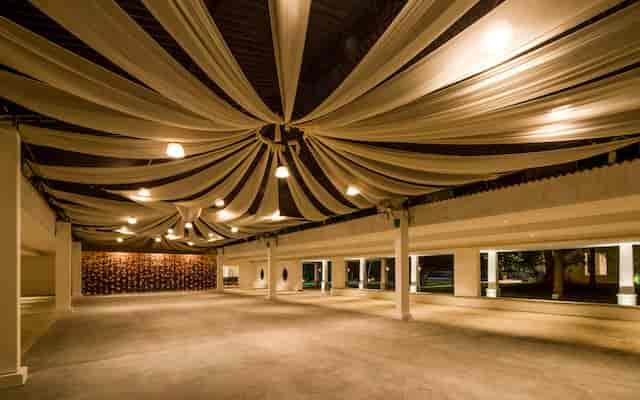 Elegant event space with drapery and ambient lighting at Moongate Events Venue.