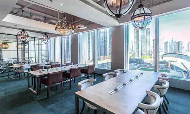 Sophisticated meeting space with city views, ideal for corporate events in Bangalore.