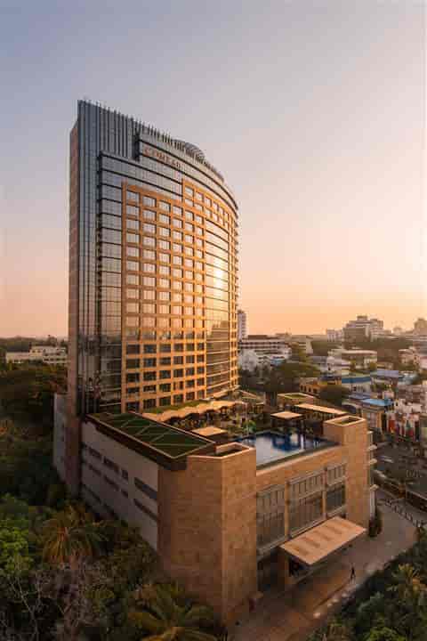 Executive Boardroom at Conrad Bengaluru: modern venue with glass facade for events.