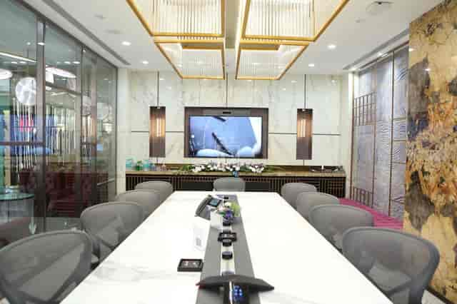 Modern conference room with marble table for professional meetings and presentations.