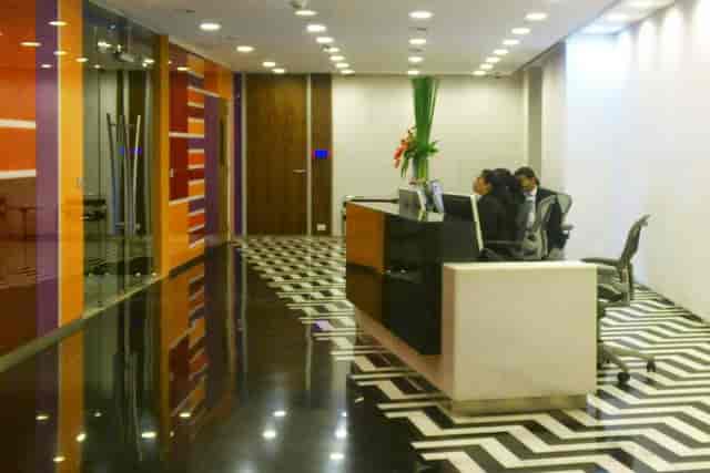 Sleek breakout area with geometric floors, ideal for meetings and networking events.