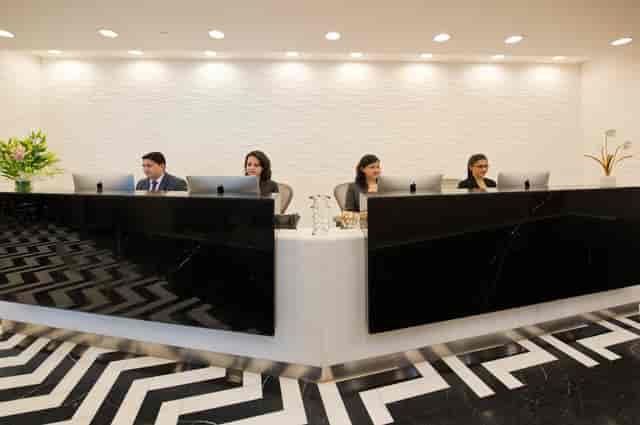 Sleek reception area with polished chevron floors for professional events and meetings.
