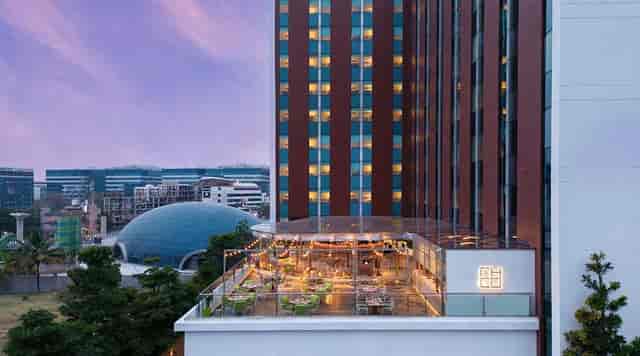 Echo Lounge Bar rooftop event space in Aloft Bengaluru, modern architecture, networking venue.