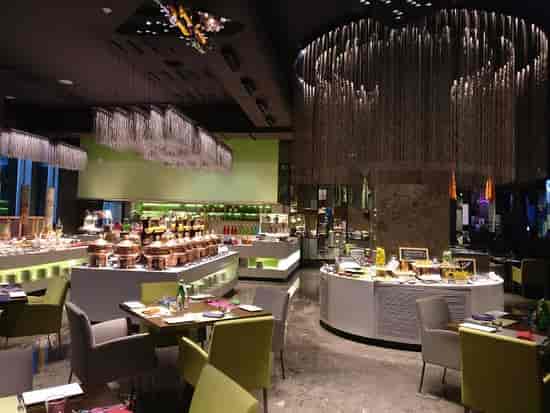 Modern dining venue in Aloft Bengaluru with buffet layout for events and gatherings.