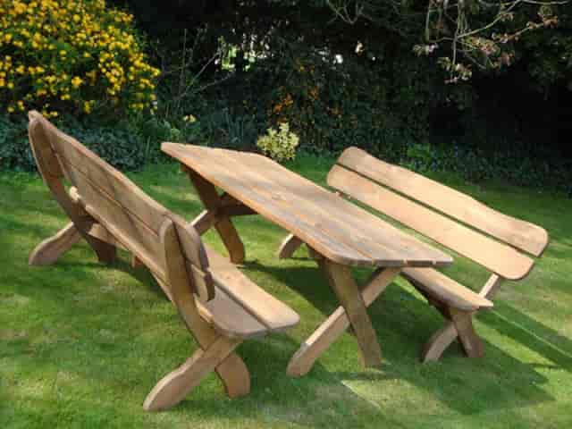 Rustic outdoor patio seating in a garden cafe, perfect for casual gatherings and events.