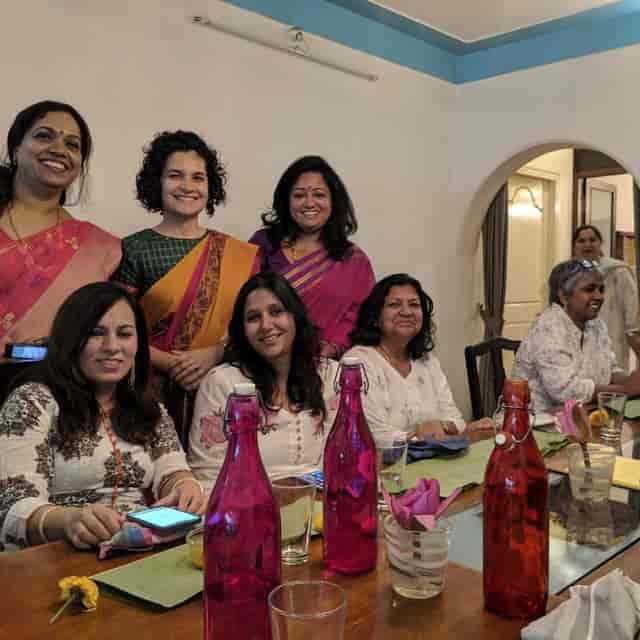 Vibrant women in colorful attire at Bengaluru Oota Company event, showcasing inclusivity and engagement.