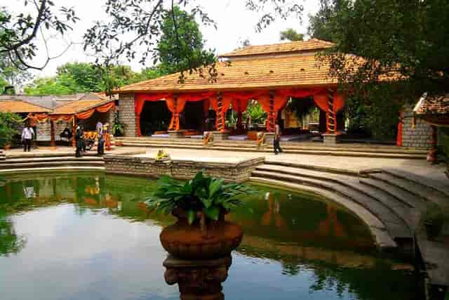 Garden area at The Tamarind Tree with vibrant drapery, ideal for weddings and retreats.