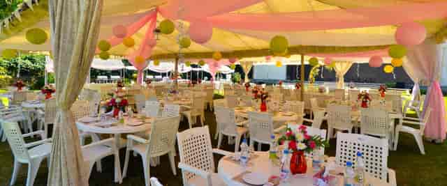 Outdoor event space at Windflower Resorts with vibrant floral centerpieces, ideal for weddings.