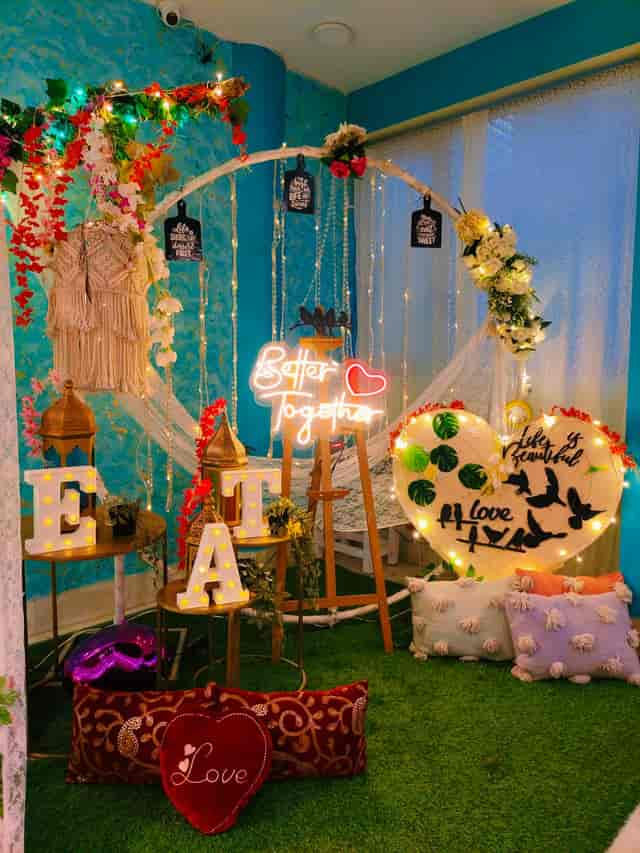 Tree Garden Indoor Restro Lounge: vibrant event space with floral decor for intimate celebrations.