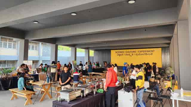 Activity Hall at Science Gallery Bengaluru, vibrant outdoor event with food vendors and activities.