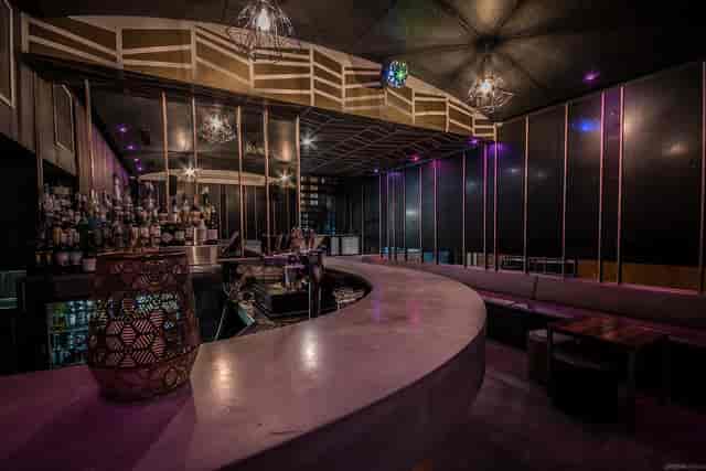 Modern Lounge Bar in Arcadia Hotel with sleek curved countertop, ideal for events.