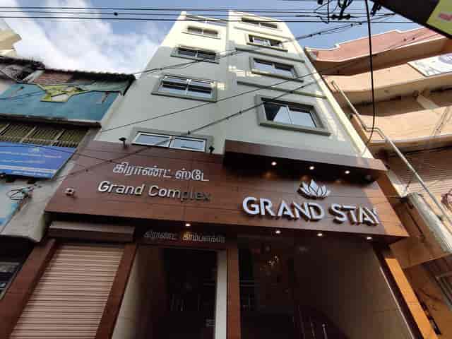 Grand Stay venue exterior with modern facade, ideal for corporate events and celebrations.