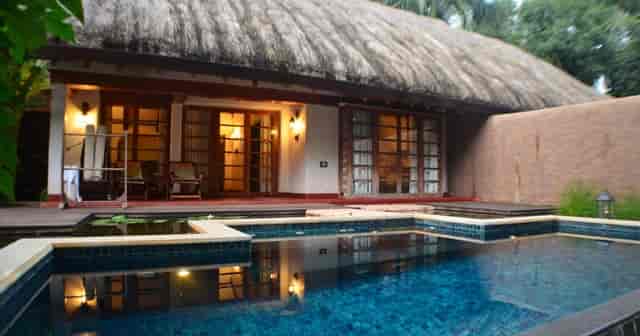 Charming Pool Reserve venue with thatched roof for intimate gatherings and retreats.
