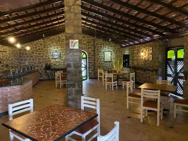 Conference Hall in Kodaikanal with rustic stone walls, perfect for workshops and meetings.