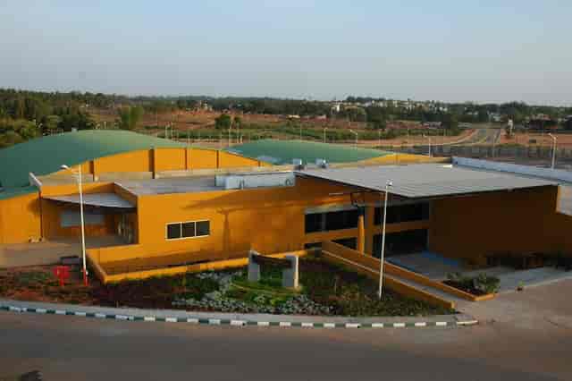 Jacaranda at Bangalore Exhibition Centre, vibrant yellow architecture for events and gatherings.