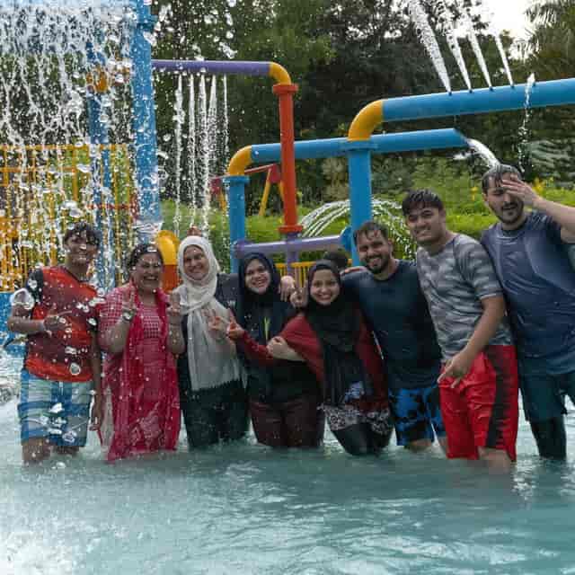 Vibrant outdoor team-building event at Club Cabana with water activities.