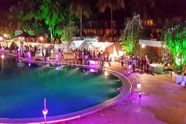 Outdoor reception at Golden Grand, featuring colorful lights by the pool.