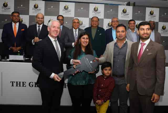 Meeting room event at JW Marriott Bengaluru with key representatives celebrating a milestone.