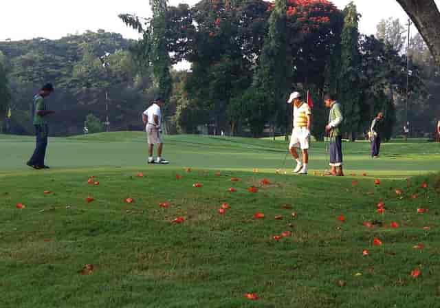 Serene Bangalore Golf Club course with lush greens, ideal for corporate outings and team-building.