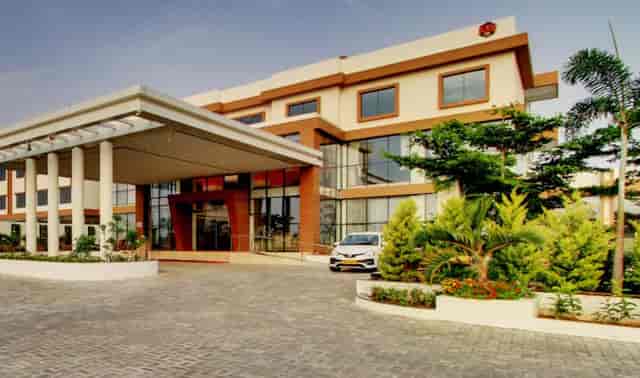 Modern event space at Ramada Bengaluru Yelahanka, featuring a glass facade and natural light.