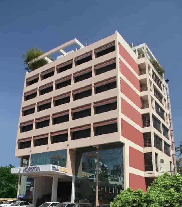 Modern conference hall at Hotel Horizon with large windows for corporate events.