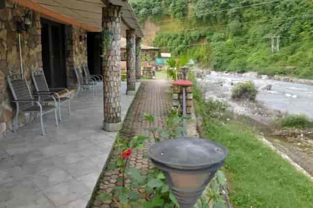 Cottages in Chardham Hotel, stone architecture, serene outdoor event venue