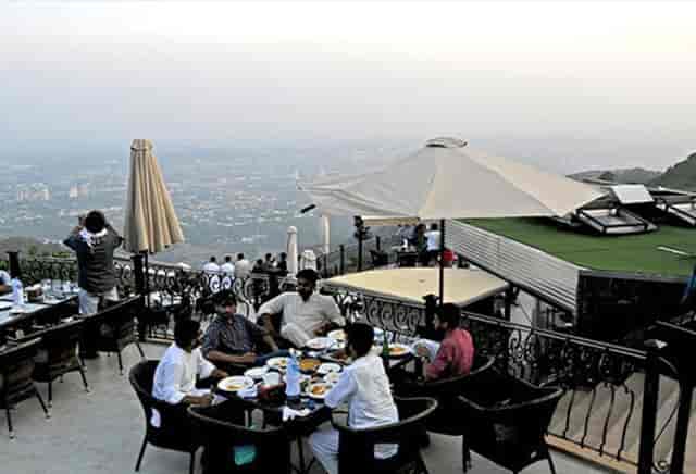 Outdoor terrace dining at The Monal with upscale ambiance for events.