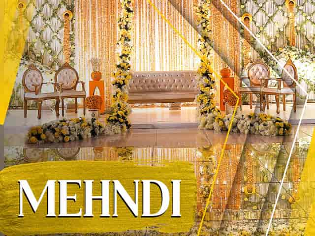Elegant Mehndi ceremony venue with floral decor and inviting seating in Bukhara Royale.