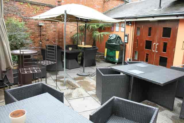Outdoor event space at The Orange Tree with versatile seating for networking gatherings.