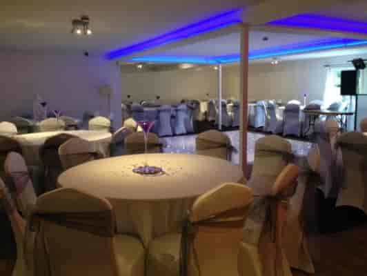 Charis Lounge event space with elegant tables, ideal for weddings and corporate gatherings.