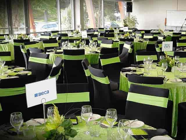 Function Rooms at The Verandah: modern banquet setting with green-accented chairs for corporate events.