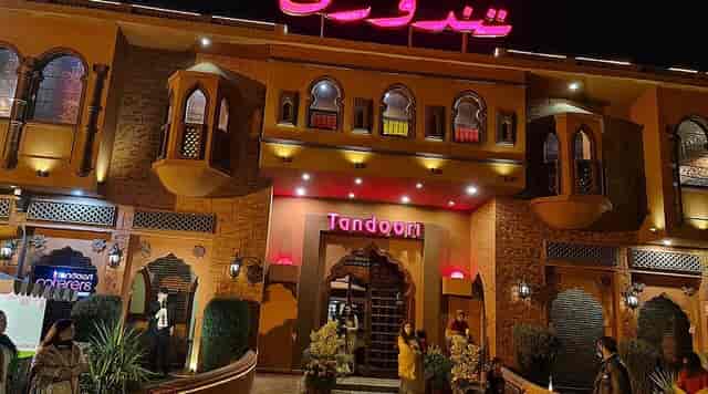 Vibrant Tandoori restaurant with warm lighting, perfect for events and celebrations.