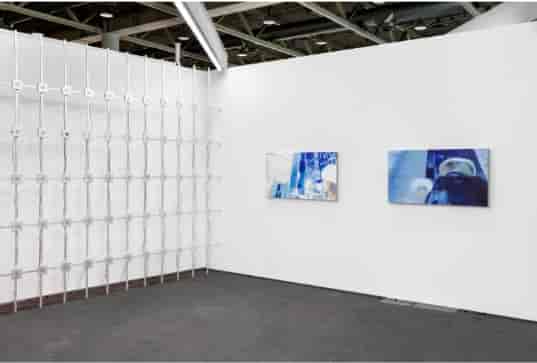 Minimalist exhibition space in Shoreditch with textured wall installation for events.