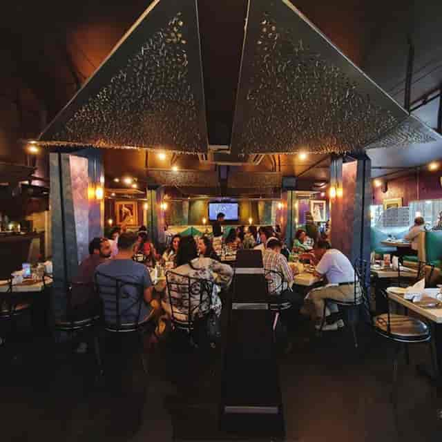 Vibrant restaurant setting at Café Zouk, ideal for corporate events and private parties.