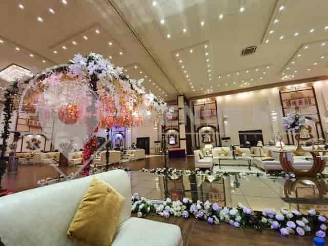 Elegant Grand Pavilion Banquet hall with floral decor, perfect for weddings and upscale events.
