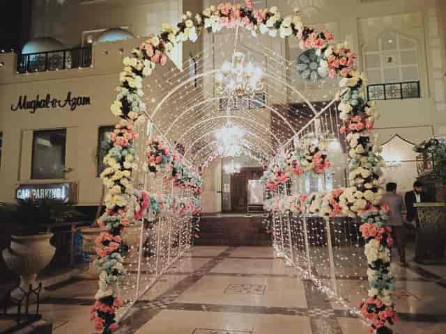 Mannsiraj Hall entrance with floral arch, ideal for weddings and upscale events.