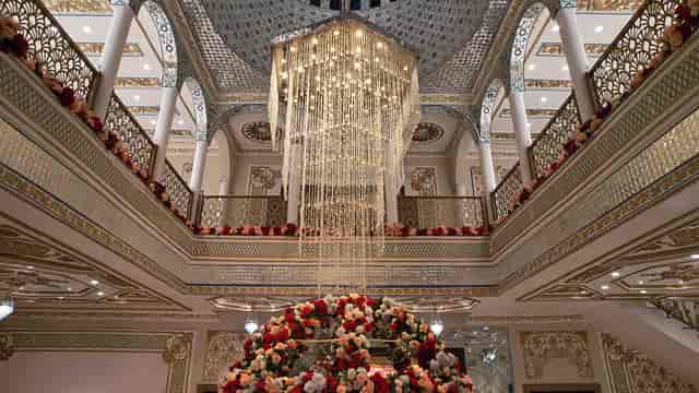 Elegant banquet hall in Lahore with stunning chandelier, perfect for weddings and events.