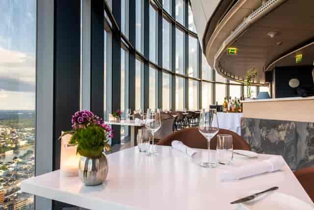 Elegant restaurant with panoramic views, perfect for corporate events and upscale gatherings.