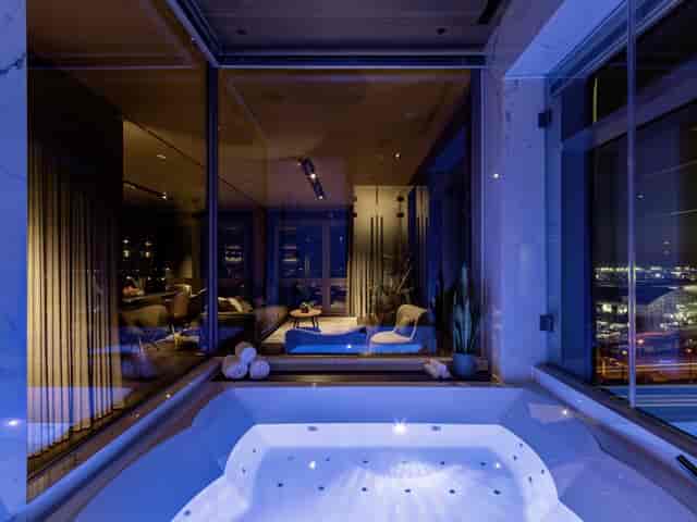 SkyLoft suite with modern hot tub at Sheraton Frankfurt, ideal for upscale events and retreats.