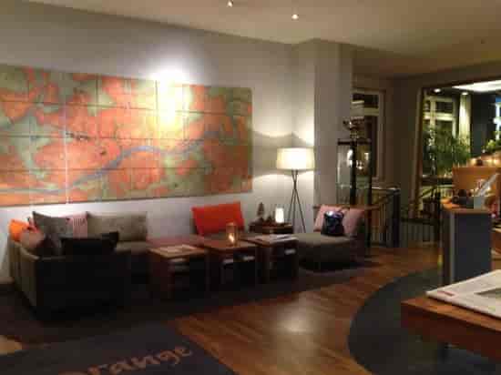 Welcoming Villa Orange lobby with cozy seating for networking and casual meetings.