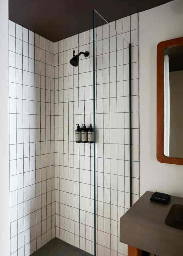 Stylish shower space at Ace Hotel Brooklyn, perfect for modern conferences and retreats.