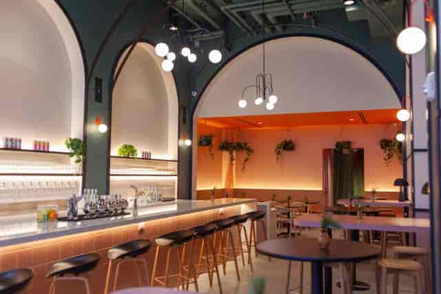 Modern coffee shop at TALEA Beer Co. with sleek seating, ideal for events and gatherings.