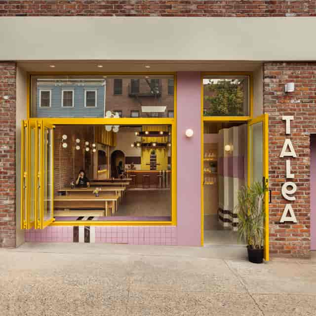 "Penn District Taproom with bright yellow accents, perfect for casual meetings and small events."