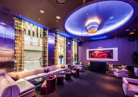 Sophisticated lounge at 48 Lounge with ambient lighting for networking events.