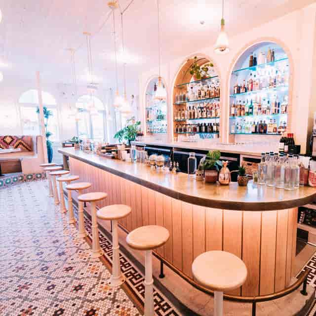 Stylish bar in Jajaja Mexicana with illuminated spirits, perfect for cocktail receptions.