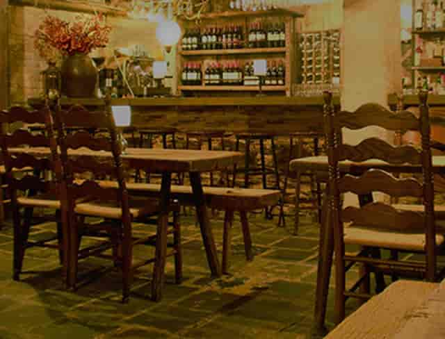 Cozy Peasant bar with wooden decor, perfect for intimate gatherings and networking events.