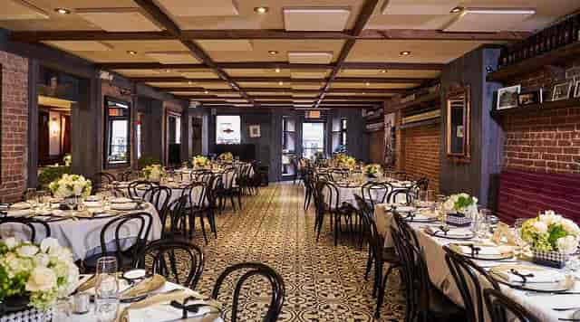 Elegant Arte Cafe bar with inviting decor, perfect for formal dinners and celebrations.