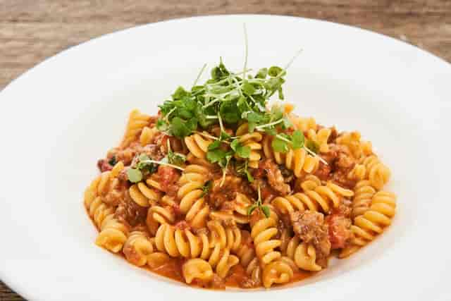 Delicious spiral pasta dish at Arte Cafe, perfect for culinary events and catering.