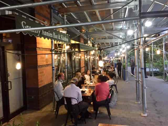Cozy outdoor dining at Granny Annie's Bar & Kitchen, perfect for networking events.